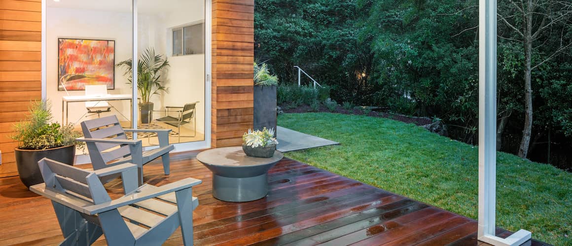 Example of what you can do with a deck loan: deck overlooking wooded backyard off of living room