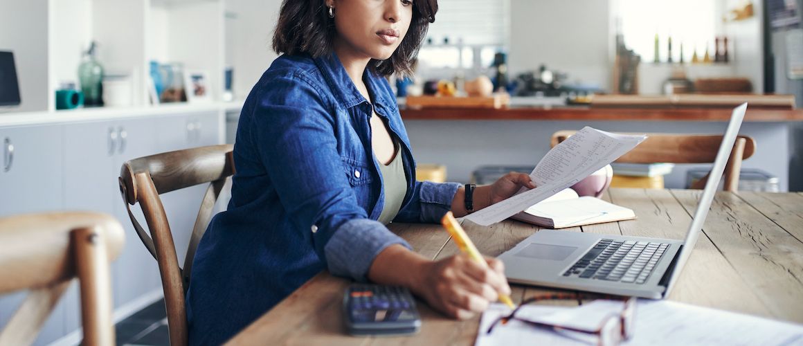 A women possibly calculating her taxes or finances.