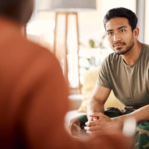 A young man engaged in conversation.