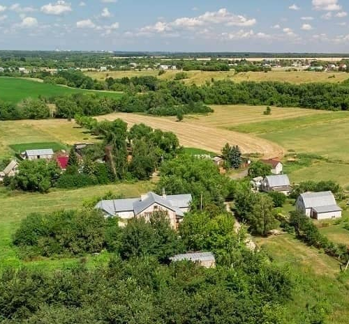 A landlocked property viewed from above, possibly indicating challenges related to access or development.