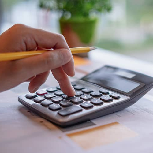 Calculation-related imagery, potentially representing financial planning or mortgage calculations.