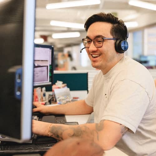 Phoenix team member working at a desk.
