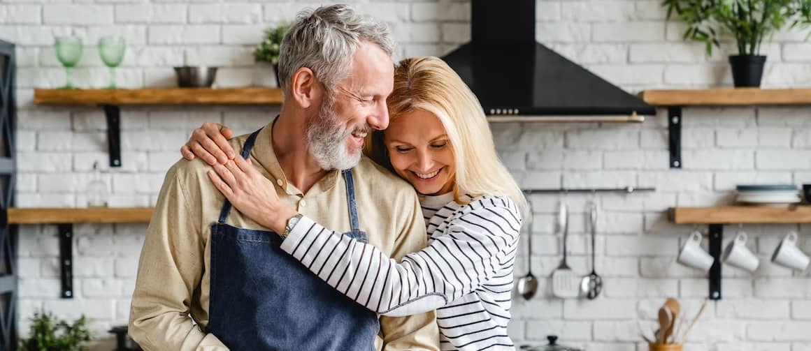 Senior couple in kitchen.