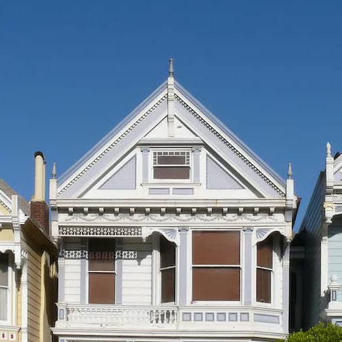 Three Victorian houses, possibly representing historic or classic home styles.