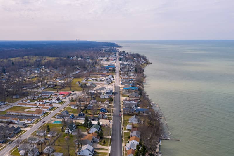 RHB Assets From IGX: A serene street in Geneva, Ohio with tree-lined sidewalks.