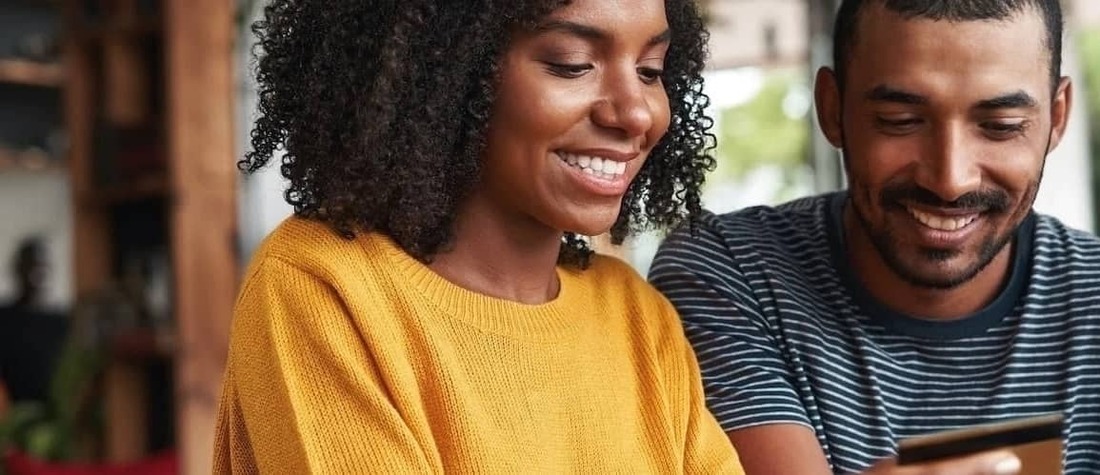 African-American couple smiling together.