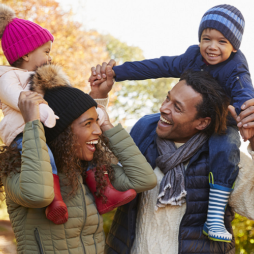Family bundled up for warmth in a promotional banner