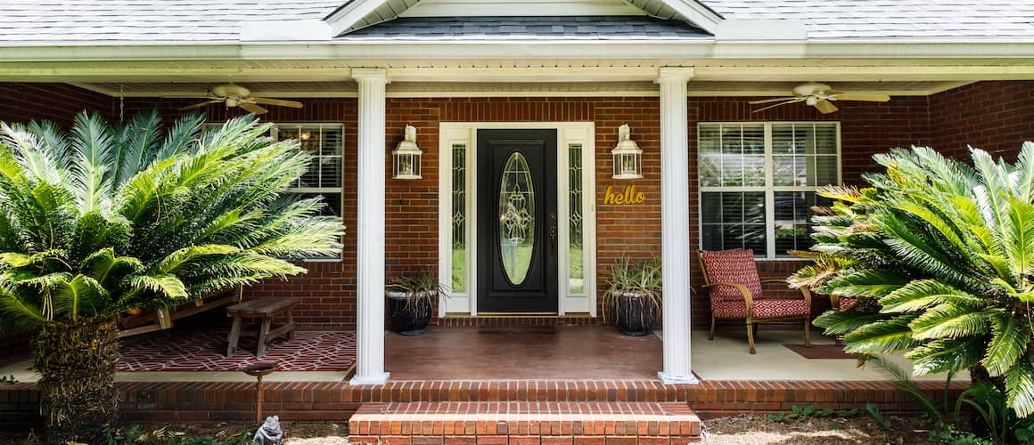 A room with hardwood floors and a large window.