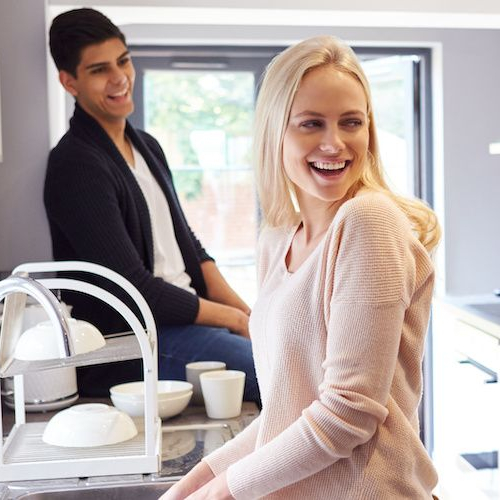 Friends living together, suggesting a group of friends sharing a living space or residence.