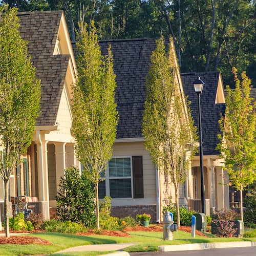 A row of townhouses, representing real estate properties.