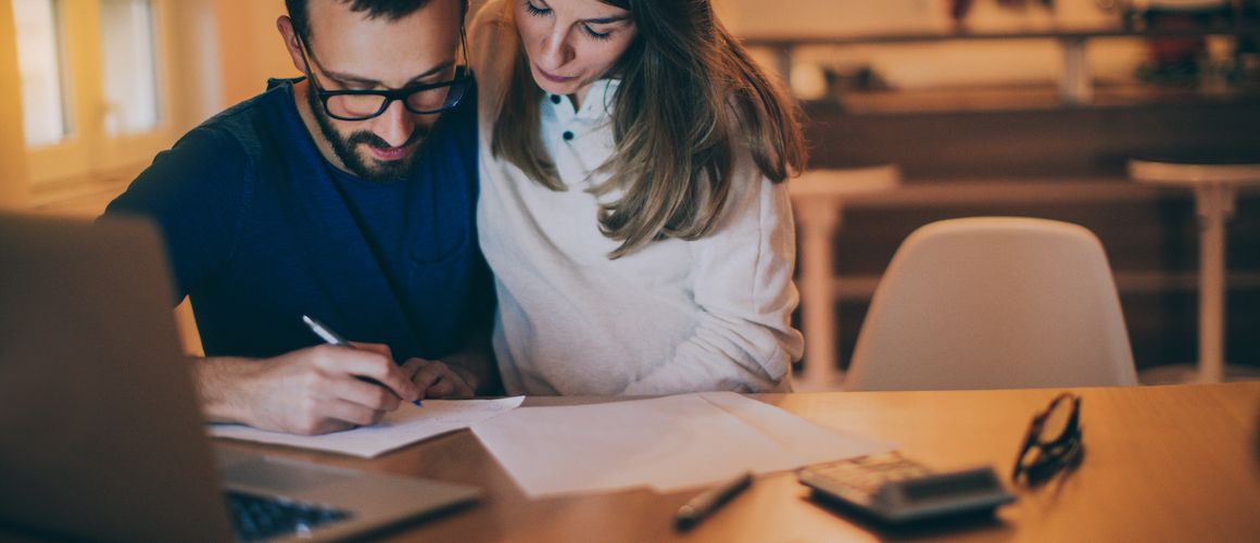 Couple looking at their budget.