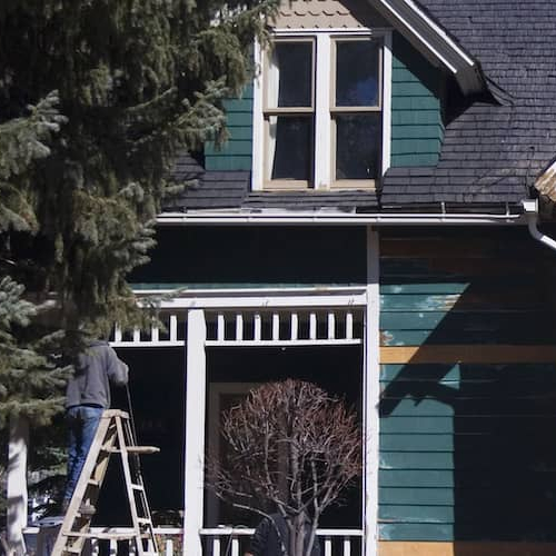 A house with peeling paint, suggesting a property in need of maintenance or renovation.
