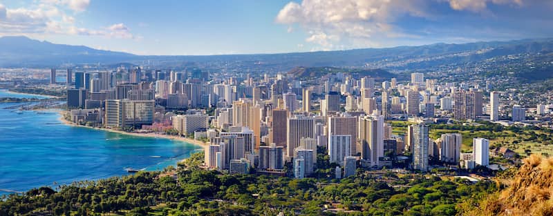 RHB Assets From IGX: Aerial view of Honolulu, Hawaii with ocean, mountains, and city skyline