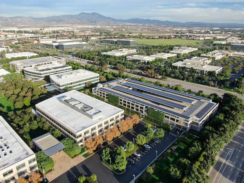 Aerial overview of large, flat buildings in California.