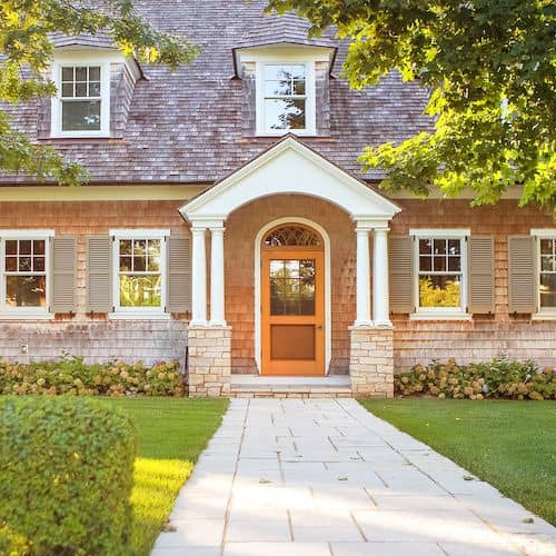 Exterior view of a large house, showcasing a spacious and elegant residential property.