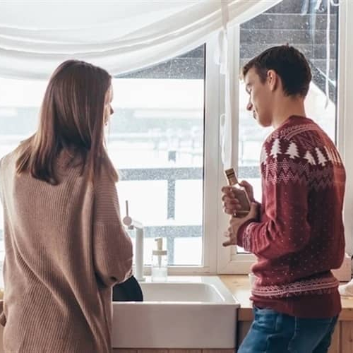Image of couple discussing home improvement ideas in kitchen.