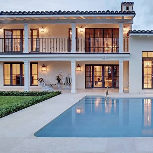 Modern house with a large pool, emphasizing a luxurious residential property.