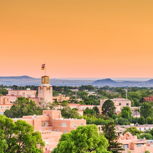 Skyline of Santa Fe, New Mexico with mountains in the background.