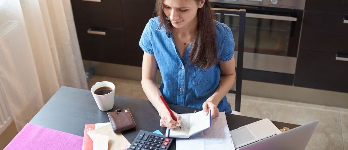 Woman working on finances at gome.