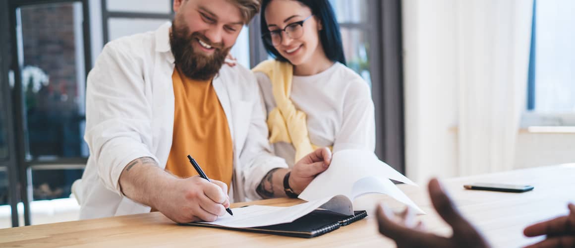 Couple Signing Mortgage