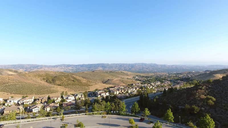 Distant view of Simi Valley, California with hills and mountains beyond.