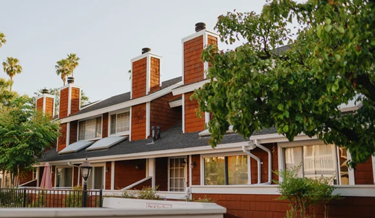 A front view of a row of townhomes.