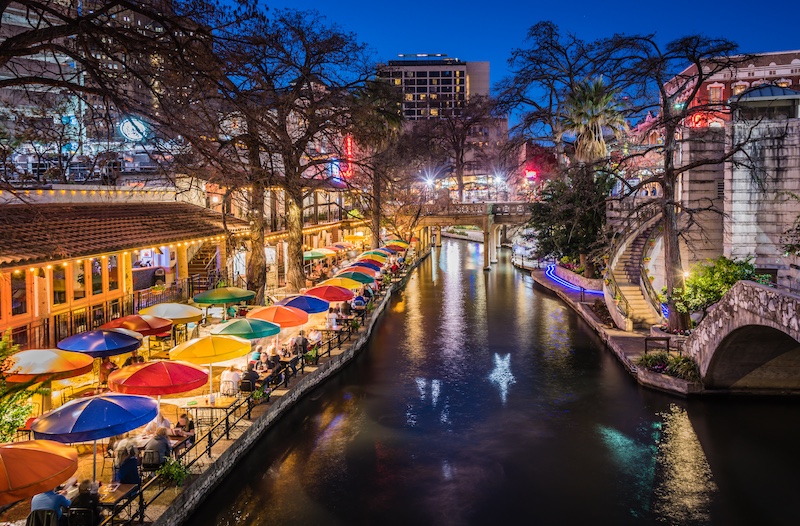 A view of the San Antonio River Walk at night.