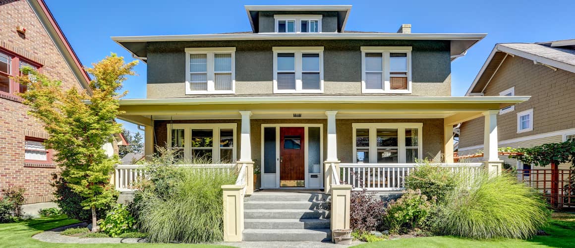 The front of a rural two story house.