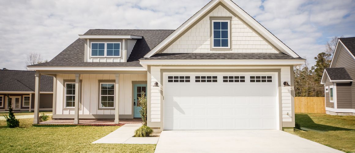 Showcasing a small house with an eye-catching Tiffany blue door.