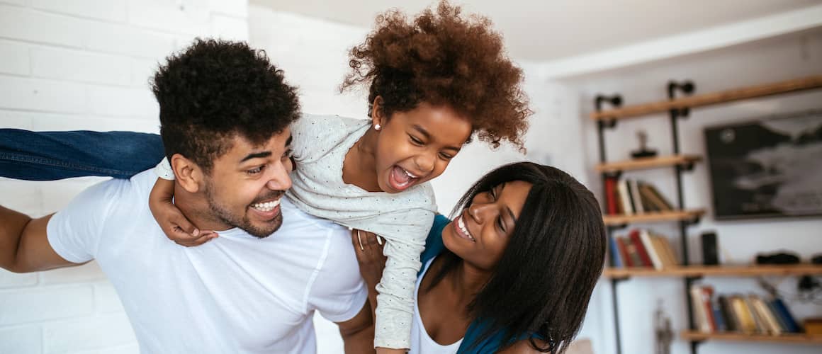 RHB Assets From IGX: African-American family playing in the living room