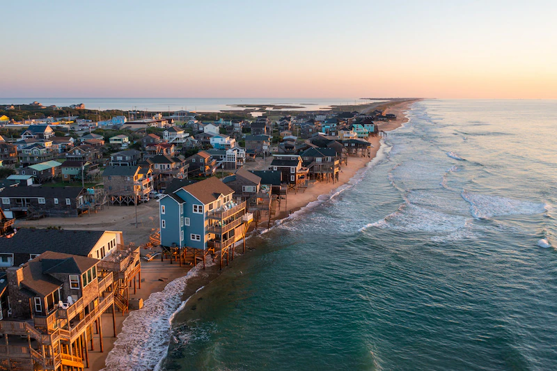 Houses on the shoreline in Hatteras Island, North Carolina.