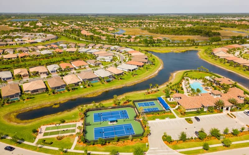 Large community with tennis courts, ponds, pools, and several small bodies of water.