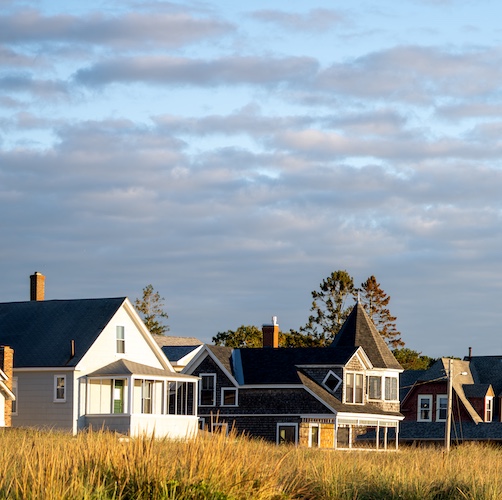 Row of homes along coast in Maine.