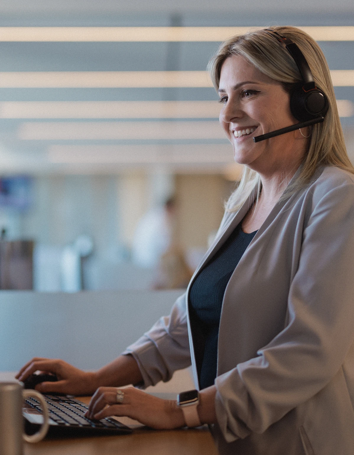 A Rocket Mortgage home loan expert wearing a headset helps a client review their mortgage.
