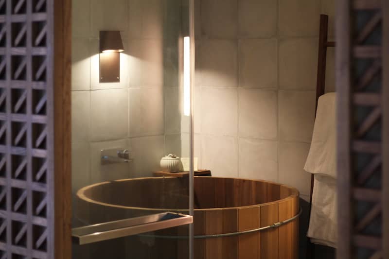 RHB Assets From IGX: Tranquil bathroom with a Japanese-style soaking tub and minimalist design.