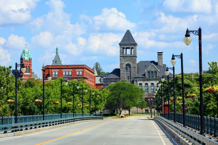 RHB Assets From IGX: Woonsocket, Rhode Island, cityscape featuring historic brick buildings and a river.