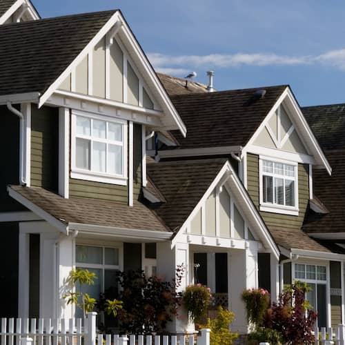 A row of townhomes, illustrating residential complexes or real estate developments.