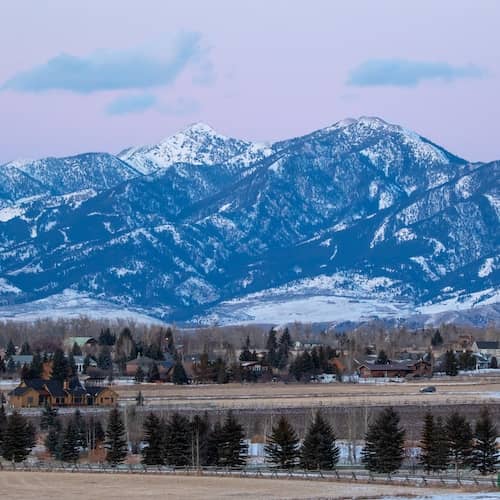 Sunset over snow covered mountains in Bozeman, Montana.