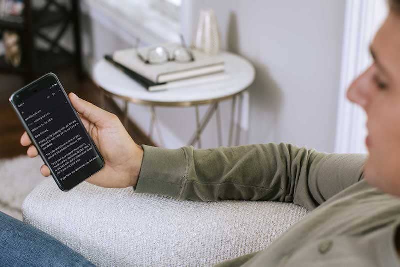 Person looking at an email on their phone.