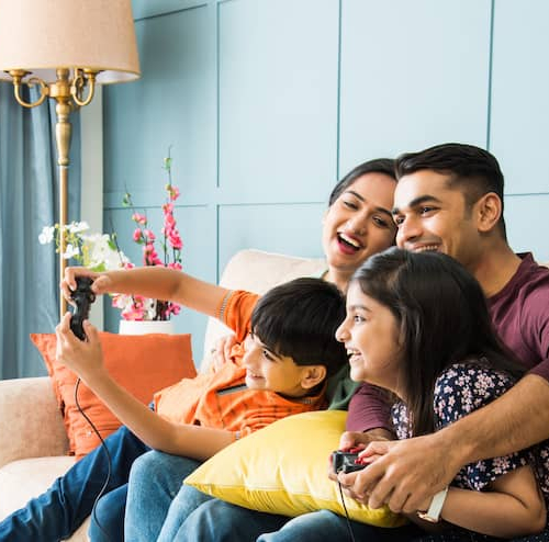 A family enjoying moments in their lounge and playing video game.