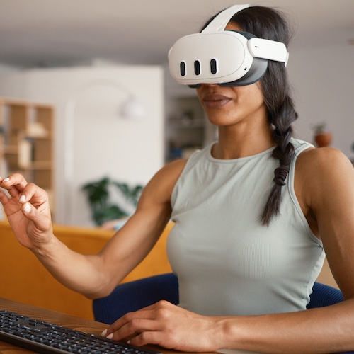Woman using VR headset in her living room.