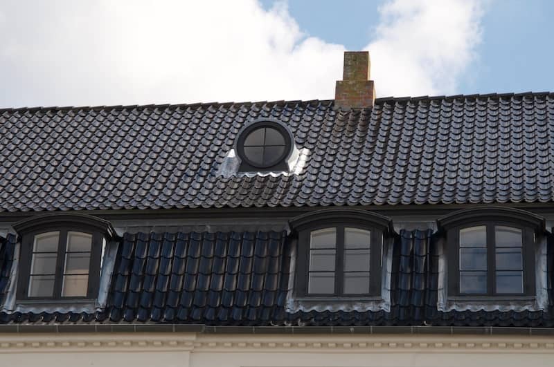 Porthole window in gabled roof.