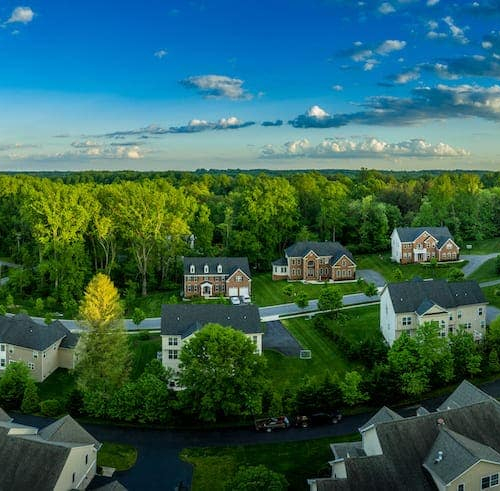 Two homes depicted in an image, potentially representing residential properties or a housing comparison.