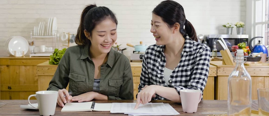 Stock-Same-Sex-Couple-At-Kitchen-Table-And-Documents-AdobeStock319405506 copy.jpg