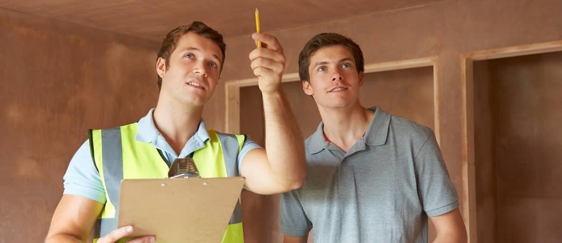 A professional home inspector guiding a homeowner through a thorough inspection of their property.