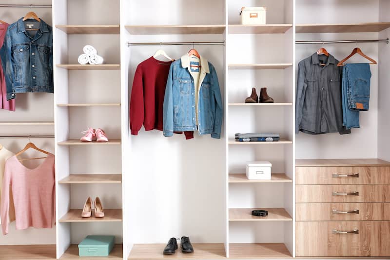 RHB Assets From IGX: Open shelving closet with organized clothes and accessories.