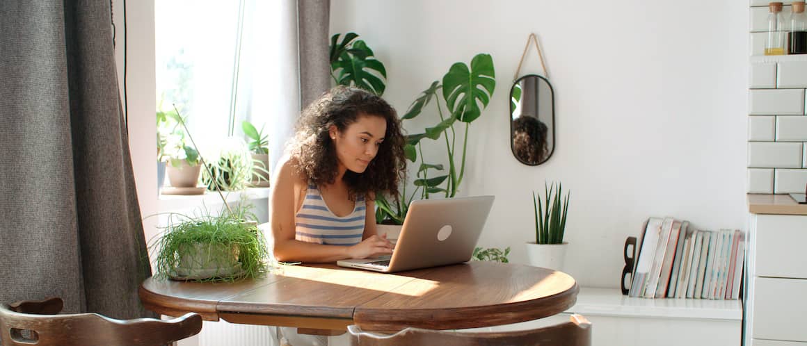 Woman updating information on computer.