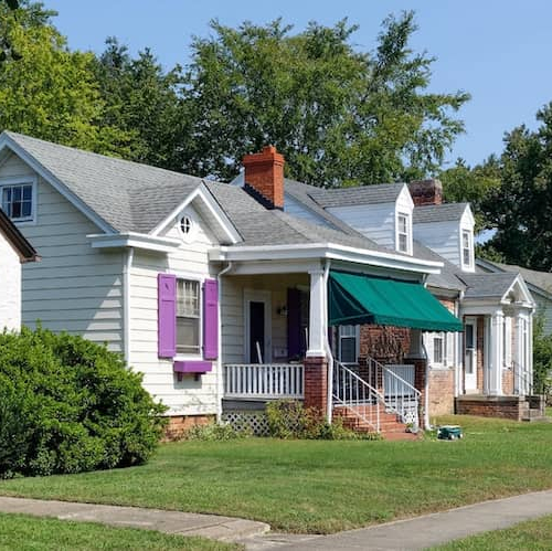 A row of bungalows, illustrating a series of single-story residential homes or a housing complex.