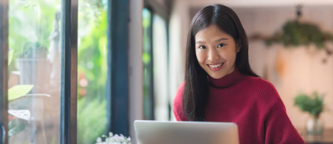 Asian Woman On Laptop