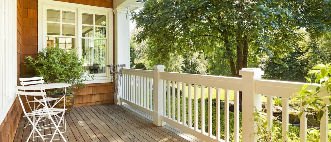 Front porch with chairs, creating a welcoming and cozy outdoor space.